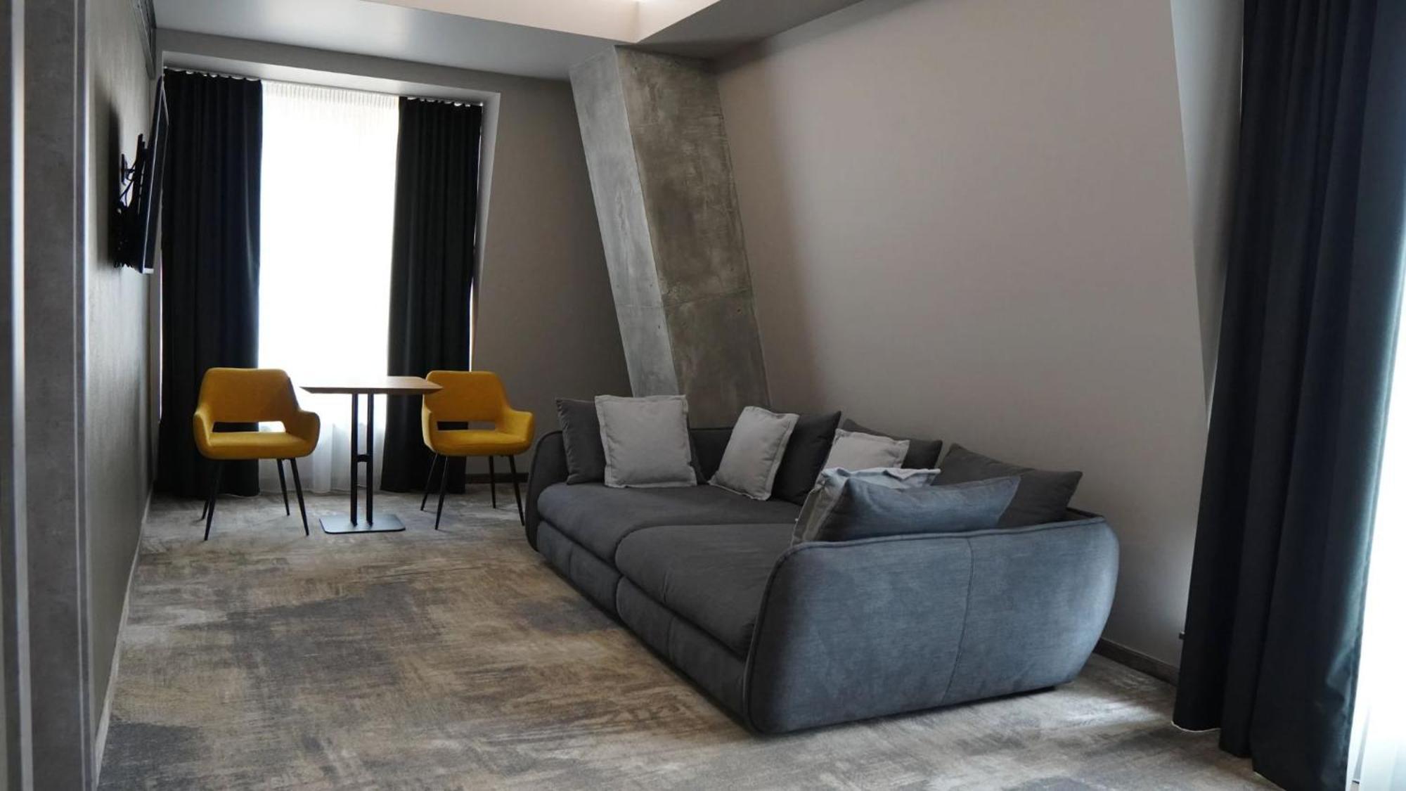 Aniroc Signature Hotel Arad Esterno foto A 3D rendering of a living room